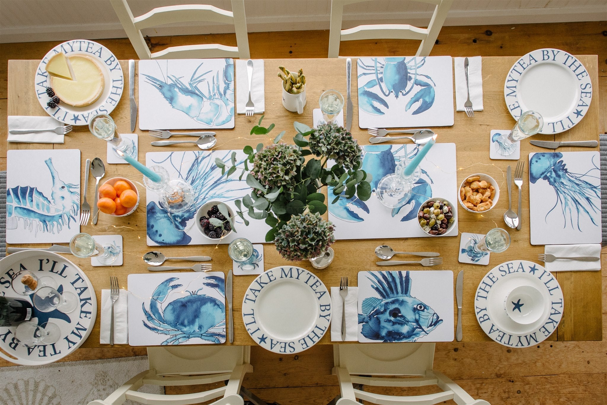 Coastal placemats & coasters with blue & white sea creatures on wipe clean, cork backed mats.